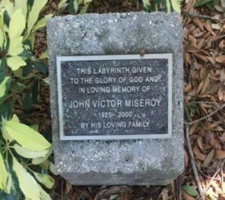 A stone plaque with the inscription " john victor misereot 1 8 2 9-2 0 0 0 "